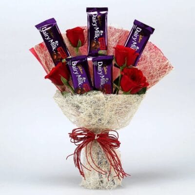 Red roses bouquet with fruit and Nut in a Jute